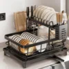 Sc82c4077e665429d992e90e3b5a9a89eH-1.webp Keep your kitchen clean, organized, and efficient with this 2‑Tier Stainless Steel Dish Drying Rack. It is built with upgraded 304 stainless steel, and therefore offers exceptional durability and resistance to rust, stains, and discoloration. As a result, you get a long‑lasting dish rack that stays sturdy even with daily use. In addition, the included plastic drainboard adds stability and prevents water from pooling on your countertop. This dish rack features an automatic drainage system designed to keep your kitchen dry and spotless. The drainboard has a slanted surface that directs water toward the center, and underneath it is a 360° rotatable, extendable drain spout. Because you can adjust the spout to match your sink’s position, excess water flows directly into the sink—never onto your counters. Furthermore, this system eliminates water stains and reduces the need for constant wiping. The 2‑tier removable design provides generous storage space while saving up to 50% of your countertop area. You can store plates, bowls, cups, utensils, and even small pans. Meanwhile, the vertical layout makes it perfect for countertops, corners, and window sills. Because of its large capacity, it’s ideal for families or anyone who wants a cleaner, more organized kitchen. Installation is quick and simple. No tools are required, and all accessories can be removed easily for cleaning. This helps prevent grease and dirt from building up in hard‑to‑reach areas. If you ever need support, our customer service team is ready to help, ensuring a smooth and worry‑free experience. Overall, this dish drying rack combines durability, convenience, and smart design to give you a cleaner and more efficient kitchen. Features